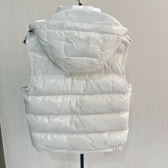 This Moncler white down vest features a mini-puffy design, offering warmth and c - Picture 2 of 8